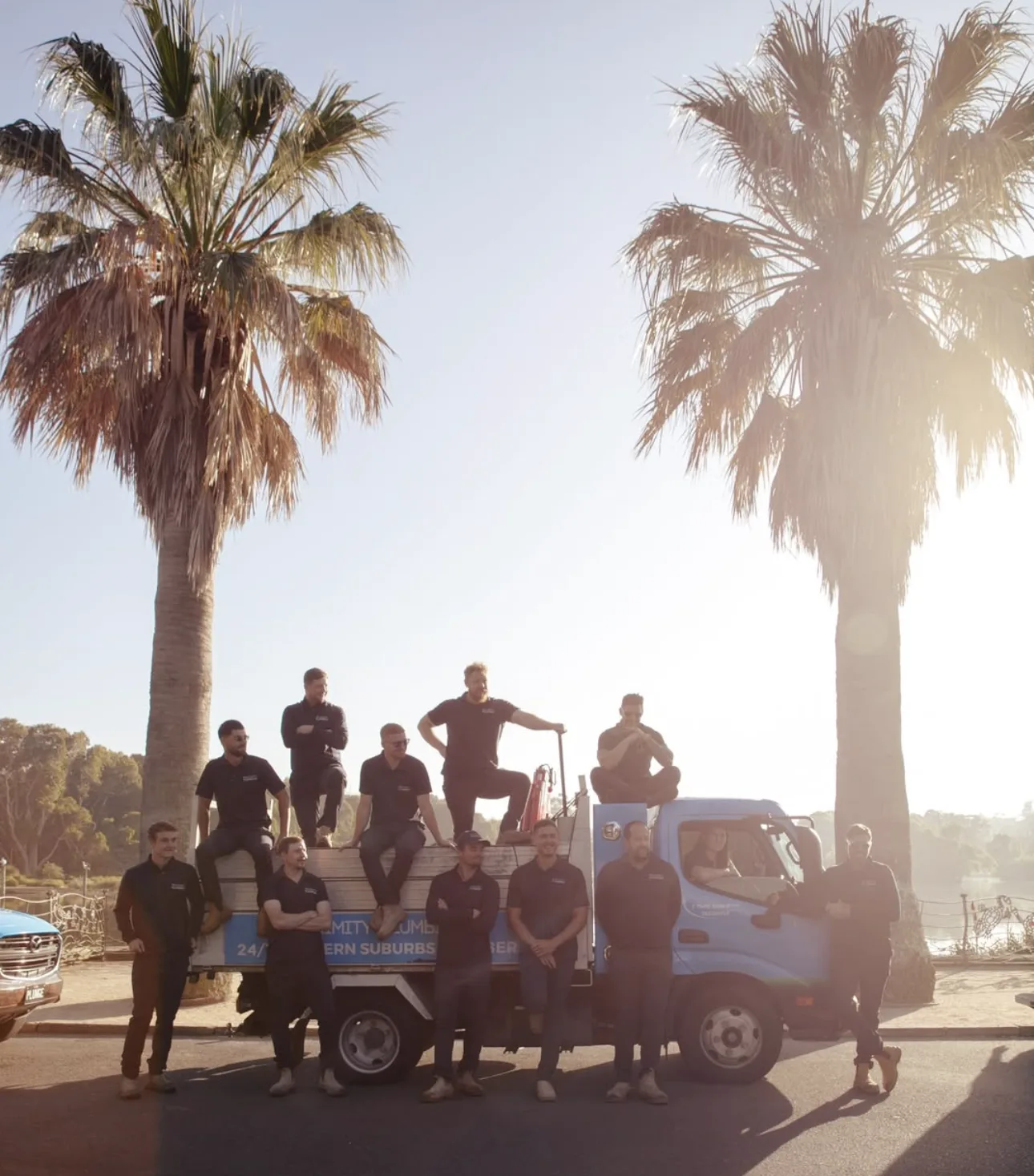 The team and their trucks parked beachside